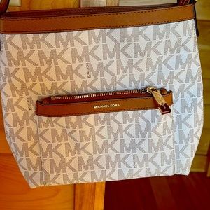 100% Authentic Micheal Kors logo crossbody purse. Purchased from outlet store.